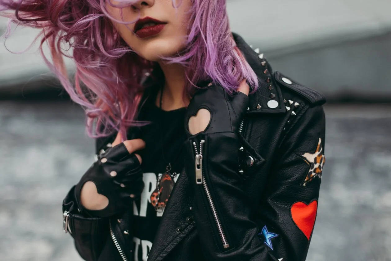 woman wears black leather zip up jacket
